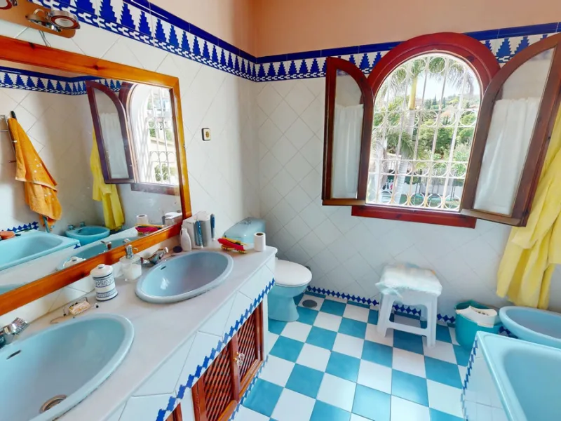 This beautiful Spanish villa spans two floors and features three bedrooms, including an impressive primary suite, and two bathrooms, blending traditional Andalusian charm with modern comfort. The Mediterranean-inspired design is reflected in the terracott