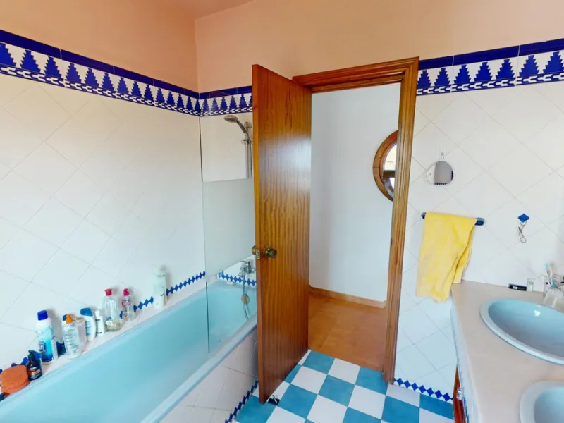 This beautiful Spanish villa spans two floors and features three bedrooms, including an impressive primary suite, and two bathrooms, blending traditional Andalusian charm with modern comfort. The Mediterranean-inspired design is reflected in the terracott