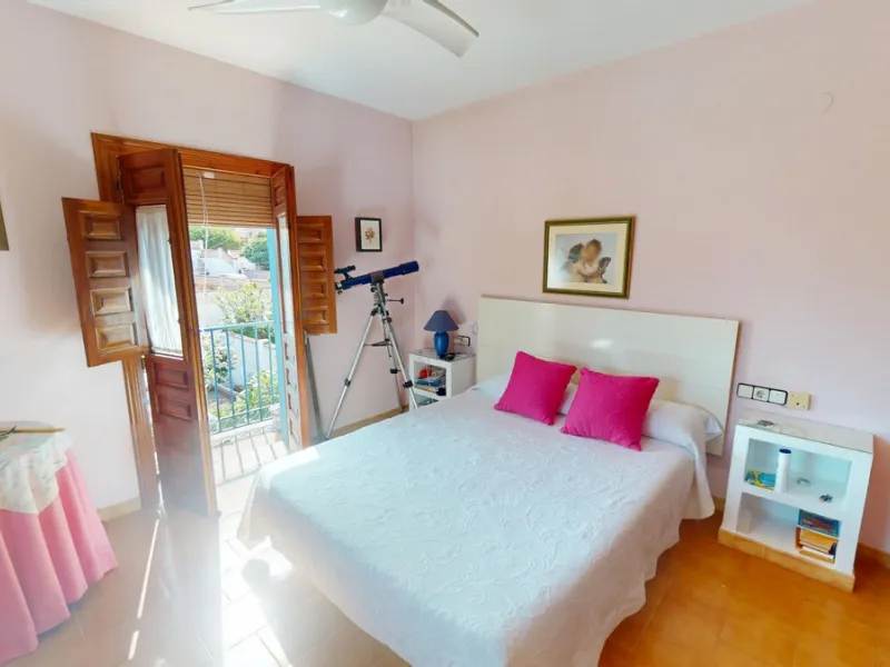 This beautiful Spanish villa spans two floors and features three bedrooms, including an impressive primary suite, and two bathrooms, blending traditional Andalusian charm with modern comfort. The Mediterranean-inspired design is reflected in the terracott