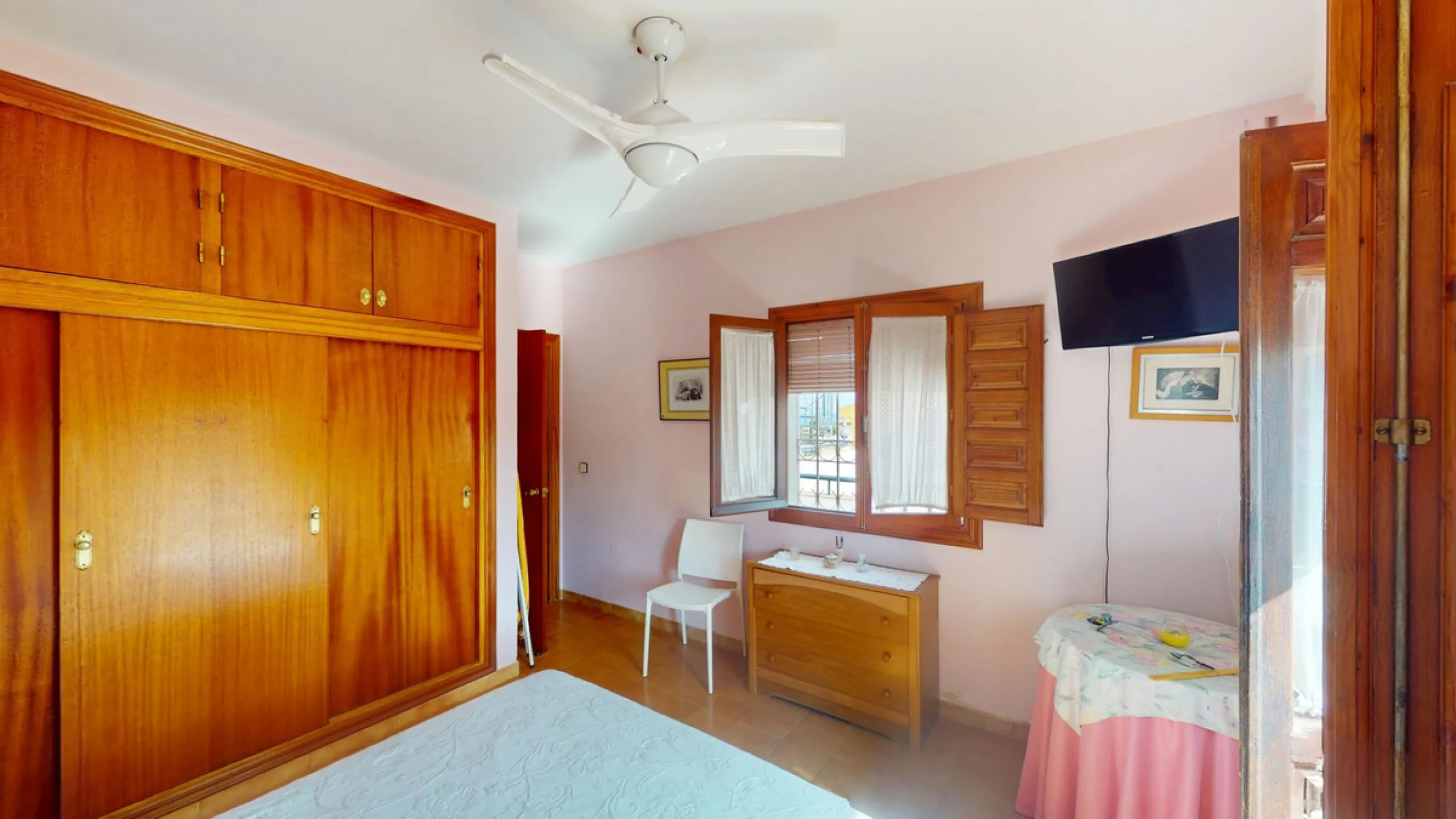 This beautiful Spanish villa spans two floors and features three bedrooms, including an impressive primary suite, and two bathrooms, blending traditional Andalusian charm with modern comfort. The Mediterranean-inspired design is reflected in the terracott