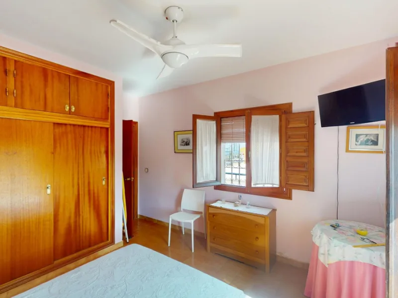 This beautiful Spanish villa spans two floors and features three bedrooms, including an impressive primary suite, and two bathrooms, blending traditional Andalusian charm with modern comfort. The Mediterranean-inspired design is reflected in the terracott