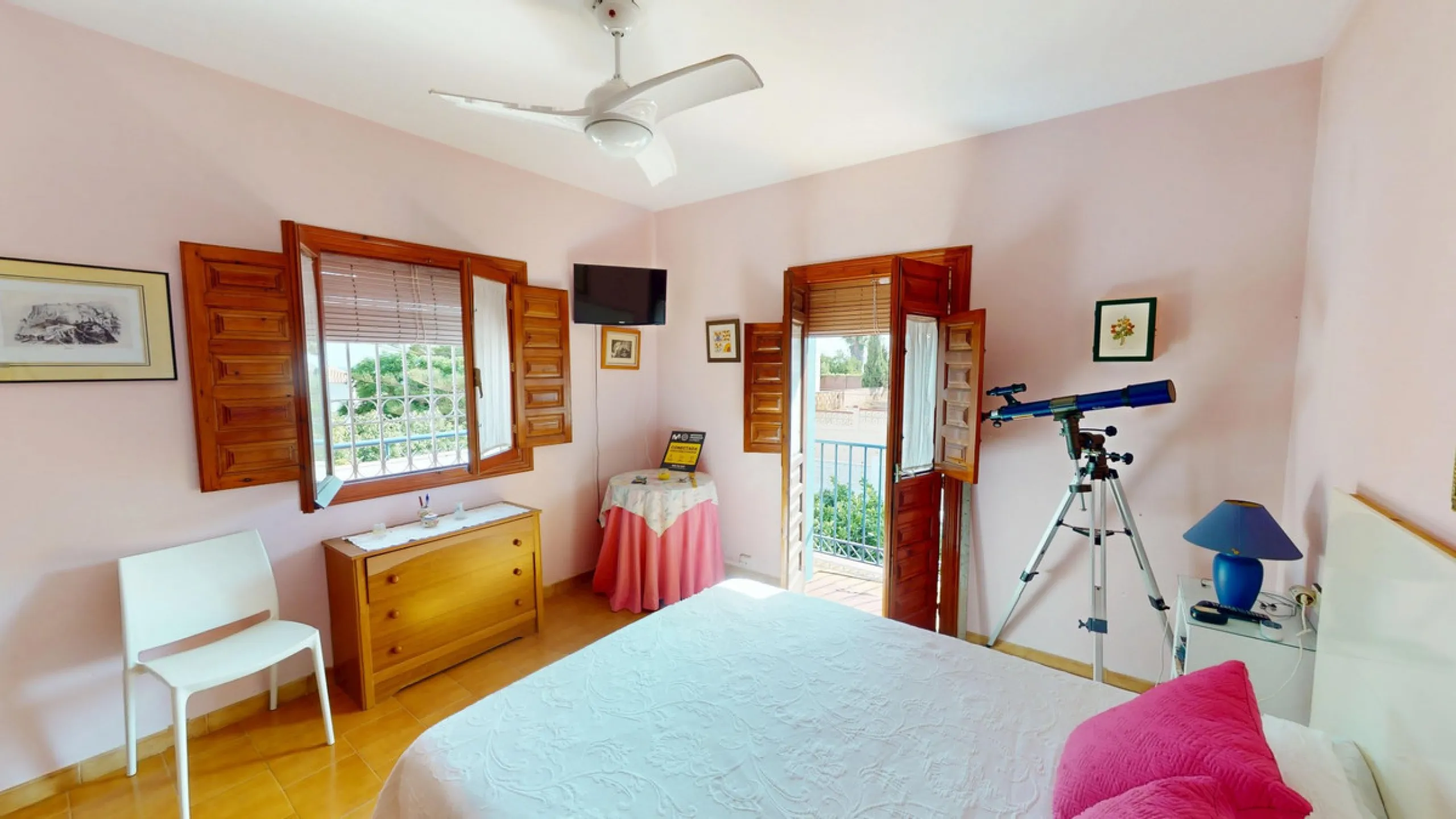 This beautiful Spanish villa spans two floors and features three bedrooms, including an impressive primary suite, and two bathrooms, blending traditional Andalusian charm with modern comfort. The Mediterranean-inspired design is reflected in the terracott