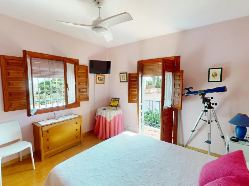 This beautiful Spanish villa spans two floors and features three bedrooms, including an impressive primary suite, and two bathrooms, blending traditional Andalusian charm with modern comfort. The Mediterranean-inspired design is reflected in the terracott