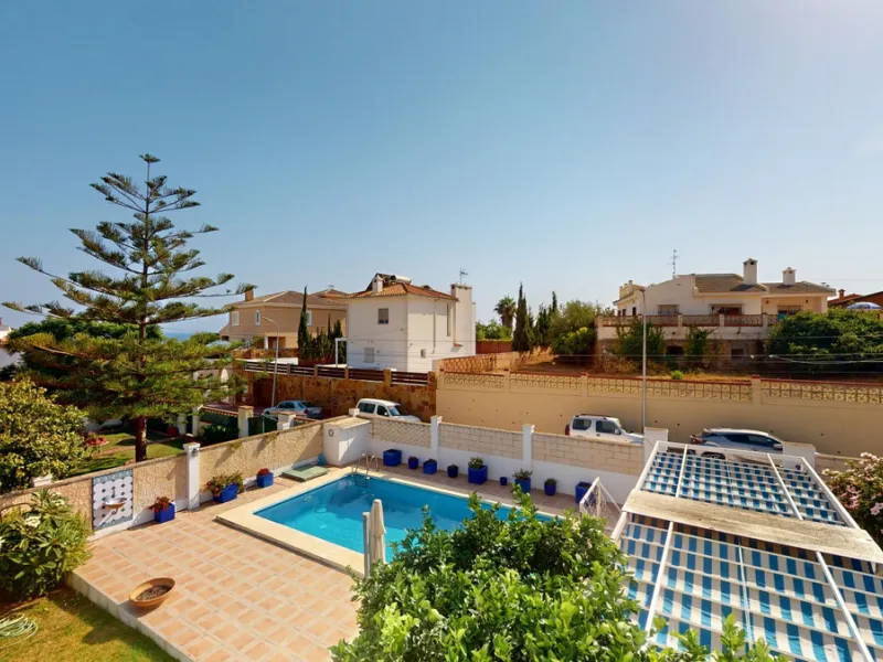 This beautiful Spanish villa spans two floors and features three bedrooms, including an impressive primary suite, and two bathrooms, blending traditional Andalusian charm with modern comfort. The Mediterranean-inspired design is reflected in the terracott