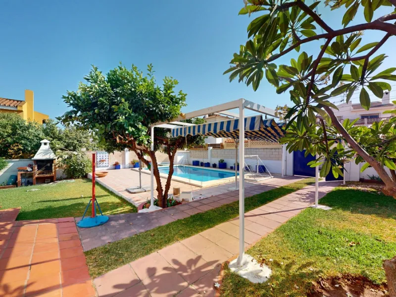 This beautiful Spanish villa spans two floors and features three bedrooms, including an impressive primary suite, and two bathrooms, blending traditional Andalusian charm with modern comfort. The Mediterranean-inspired design is reflected in the terracott