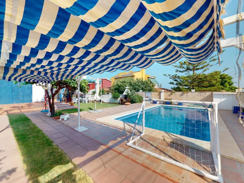 This beautiful Spanish villa spans two floors and features three bedrooms, including an impressive primary suite, and two bathrooms, blending traditional Andalusian charm with modern comfort. The Mediterranean-inspired design is reflected in the terracott