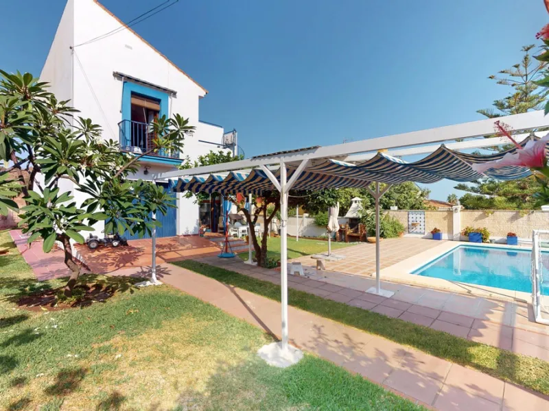 This beautiful Spanish villa spans two floors and features three bedrooms, including an impressive primary suite, and two bathrooms, blending traditional Andalusian charm with modern comfort. The Mediterranean-inspired design is reflected in the terracott