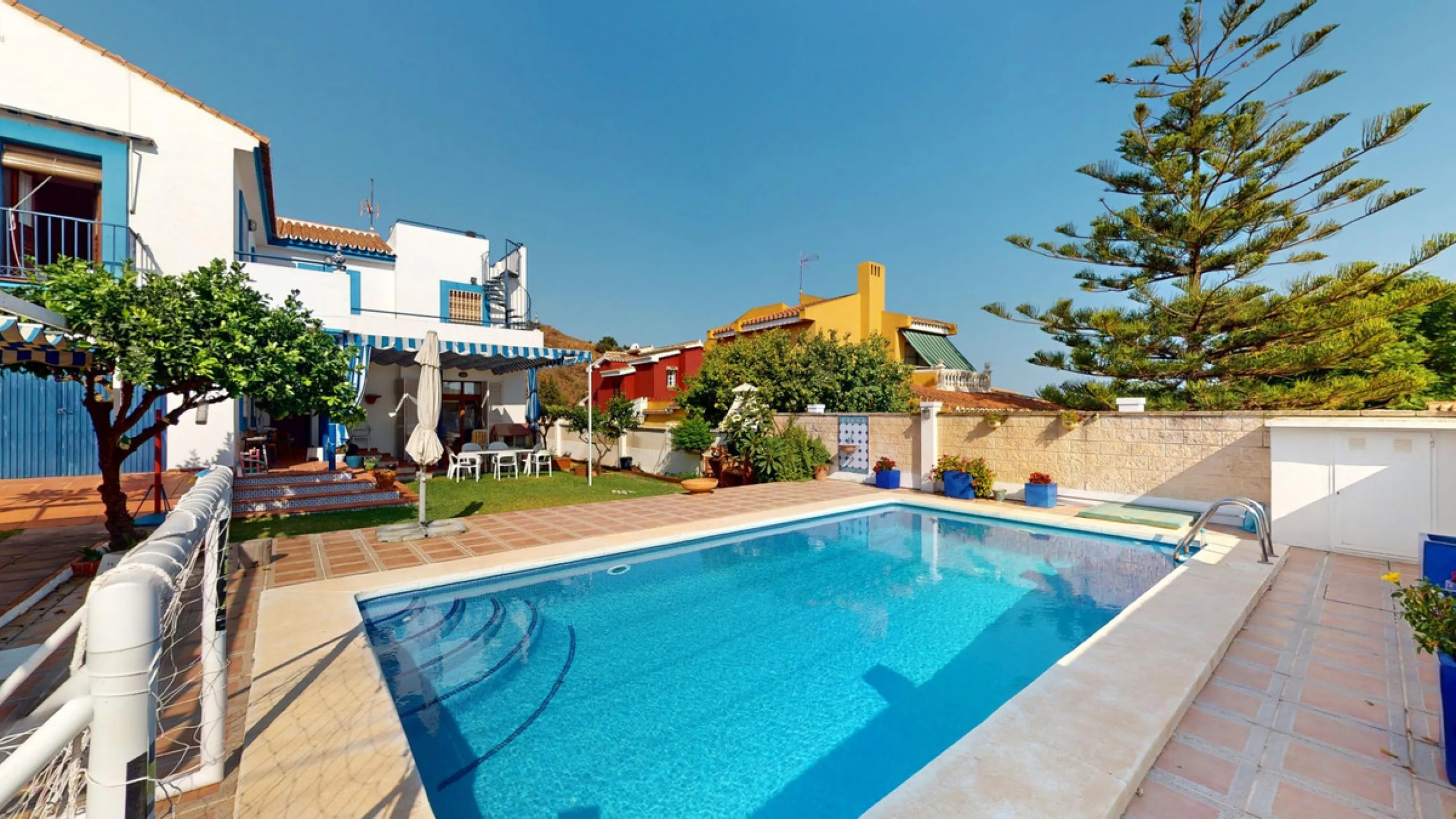 This beautiful Spanish villa spans two floors and features three bedrooms, including an impressive primary suite, and two bathrooms, blending traditional Andalusian charm with modern comfort. The Mediterranean-inspired design is reflected in the terracott
