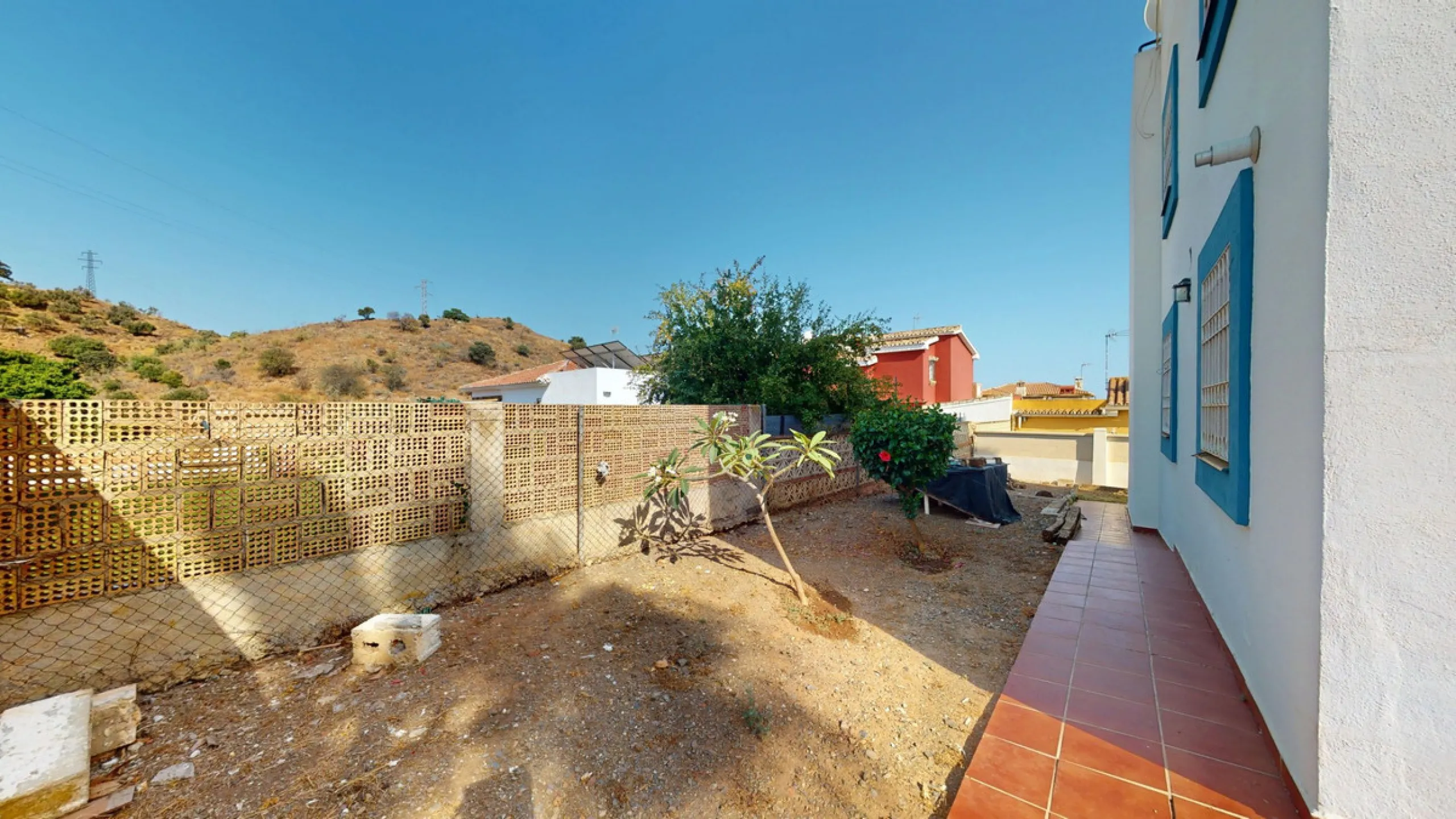 This beautiful Spanish villa spans two floors and features three bedrooms, including an impressive primary suite, and two bathrooms, blending traditional Andalusian charm with modern comfort. The Mediterranean-inspired design is reflected in the terracott