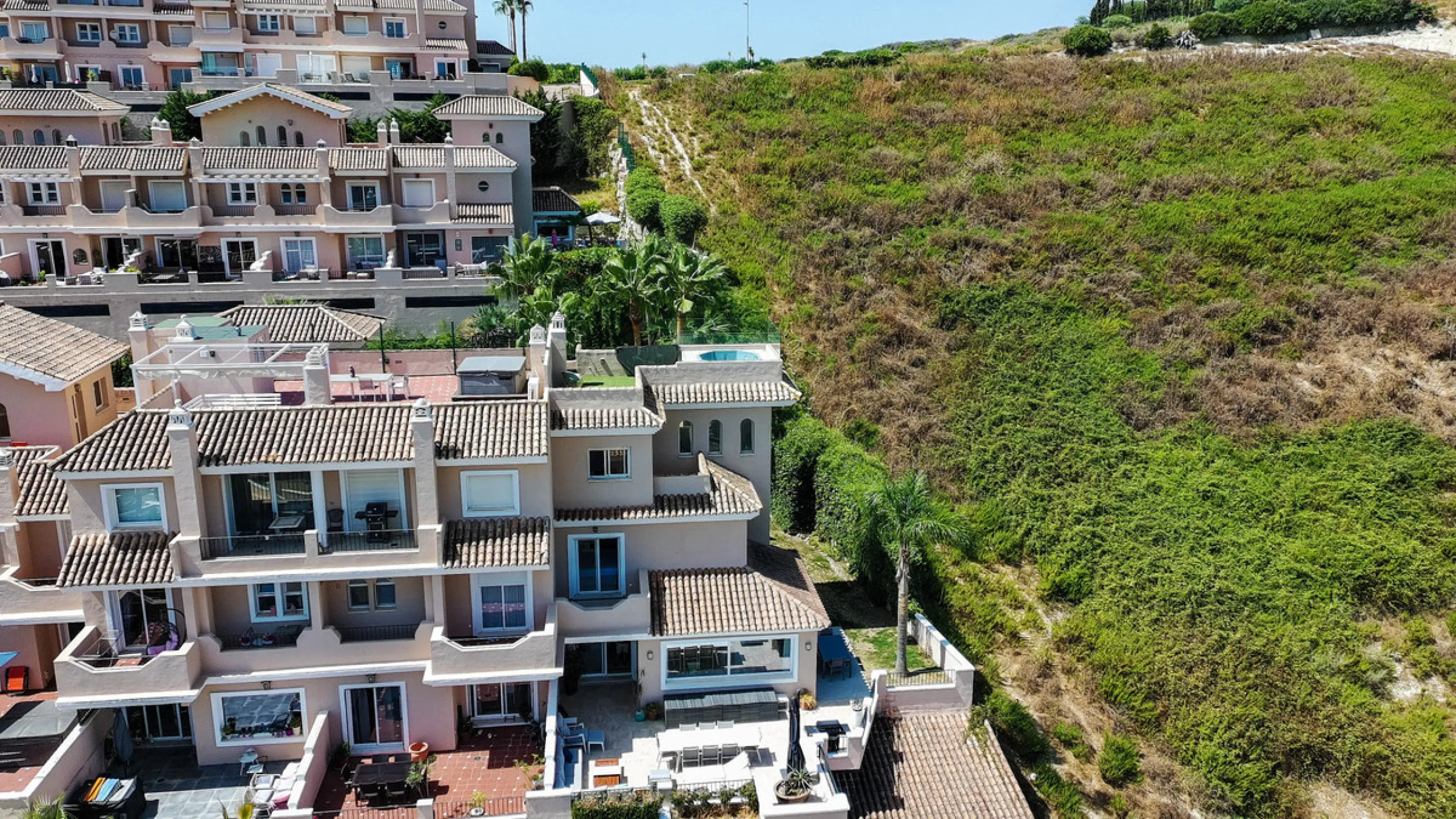Experience luxury in this refurbished and modified semi-detached home featuring 4 bedrooms, 4 bathrooms, multiple terraces, and breathtaking panoramic views. Enjoy a private garden, private pool, and roof terrace with jacuzzi—all in a tranquil, private lo