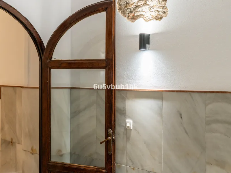 In the very heart of Málaga's historic centre, on the corner of two charming pedestrian streets, lies one of those treasures that makes the hearts of architecture lovers beat faster. This is not a move-in-ready home — it's an invitation to dream, to trans