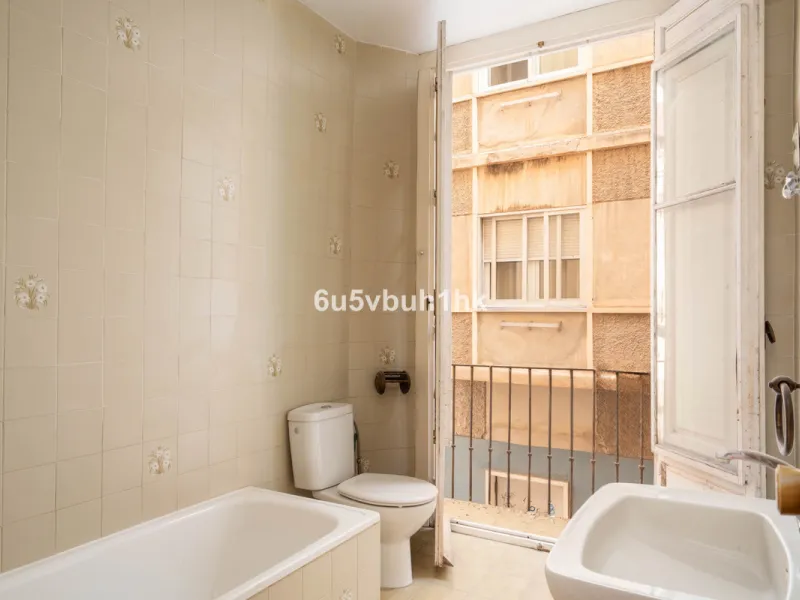 In the very heart of Málaga's historic centre, on the corner of two charming pedestrian streets, lies one of those treasures that makes the hearts of architecture lovers beat faster. This is not a move-in-ready home — it's an invitation to dream, to trans