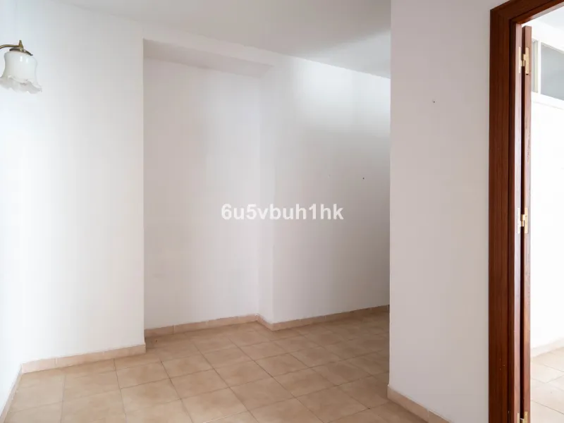 In the very heart of Málaga's historic centre, on the corner of two charming pedestrian streets, lies one of those treasures that makes the hearts of architecture lovers beat faster. This is not a move-in-ready home — it's an invitation to dream, to trans