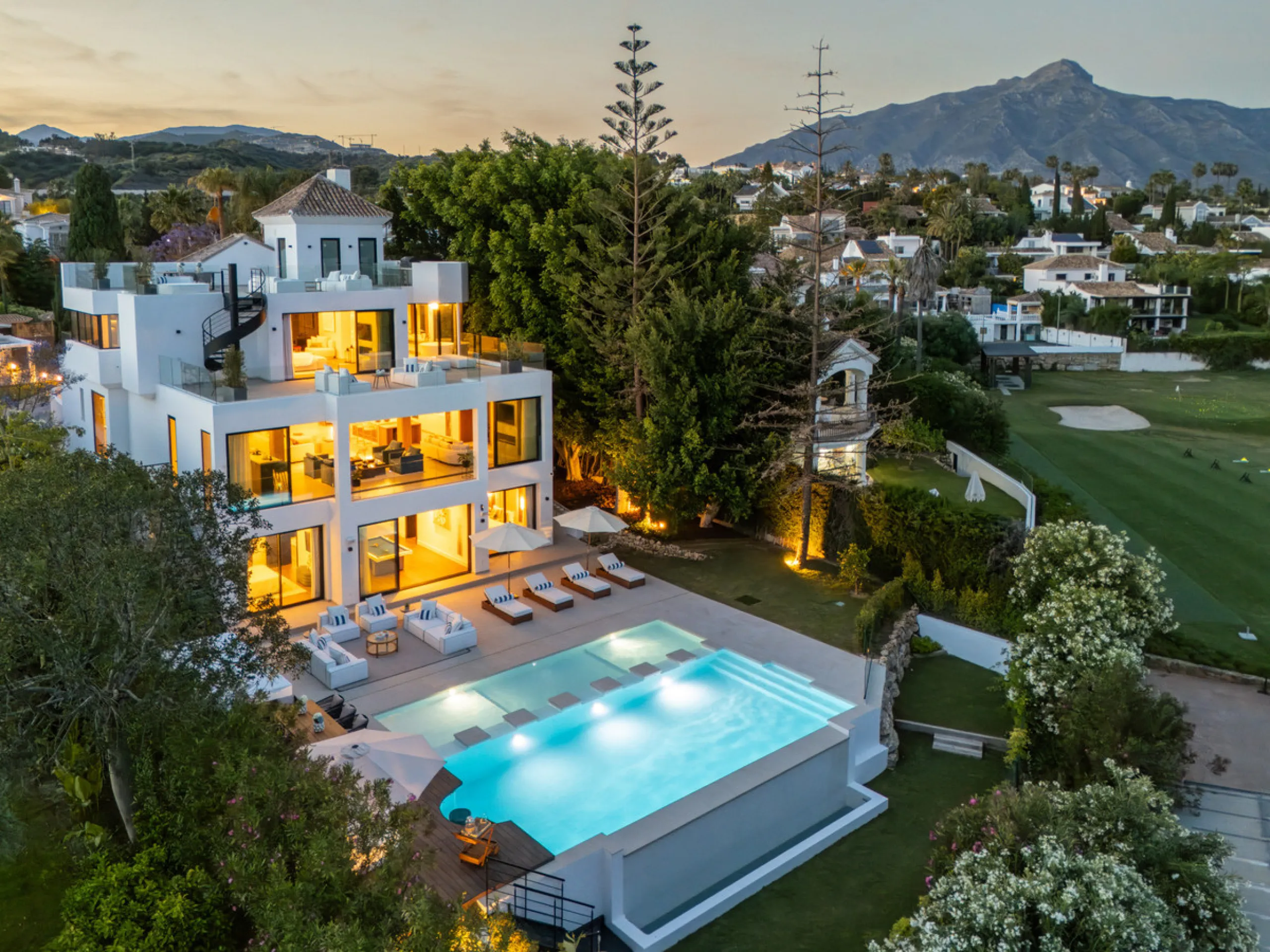 Boasting of unparalleled architecture and unrivalled construction quality, the villa offers sophisticated and contemporary living, sitting on a private plot within a secure community with breathtaking front-line panoramic views towards Los Naranjos Golf c