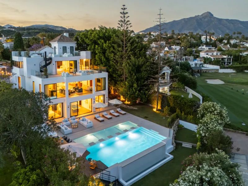 Boasting of unparalleled architecture and unrivalled construction quality, the villa offers sophisticated and contemporary living, sitting on a private plot within a secure community with breathtaking front-line panoramic views towards Los Naranjos Golf c