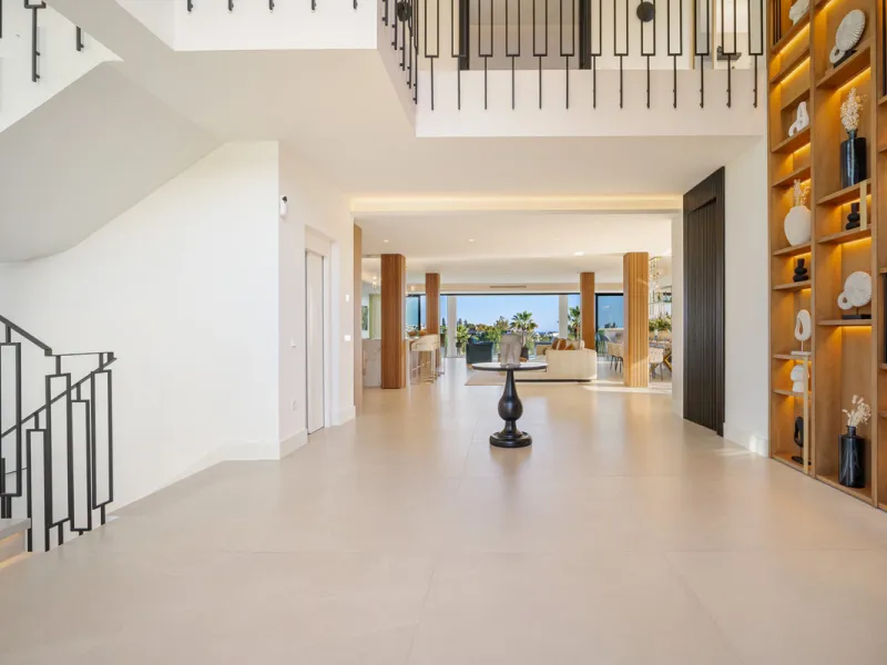 Boasting of unparalleled architecture and unrivalled construction quality, the villa offers sophisticated and contemporary living, sitting on a private plot within a secure community with breathtaking front-line panoramic views towards Los Naranjos Golf c
