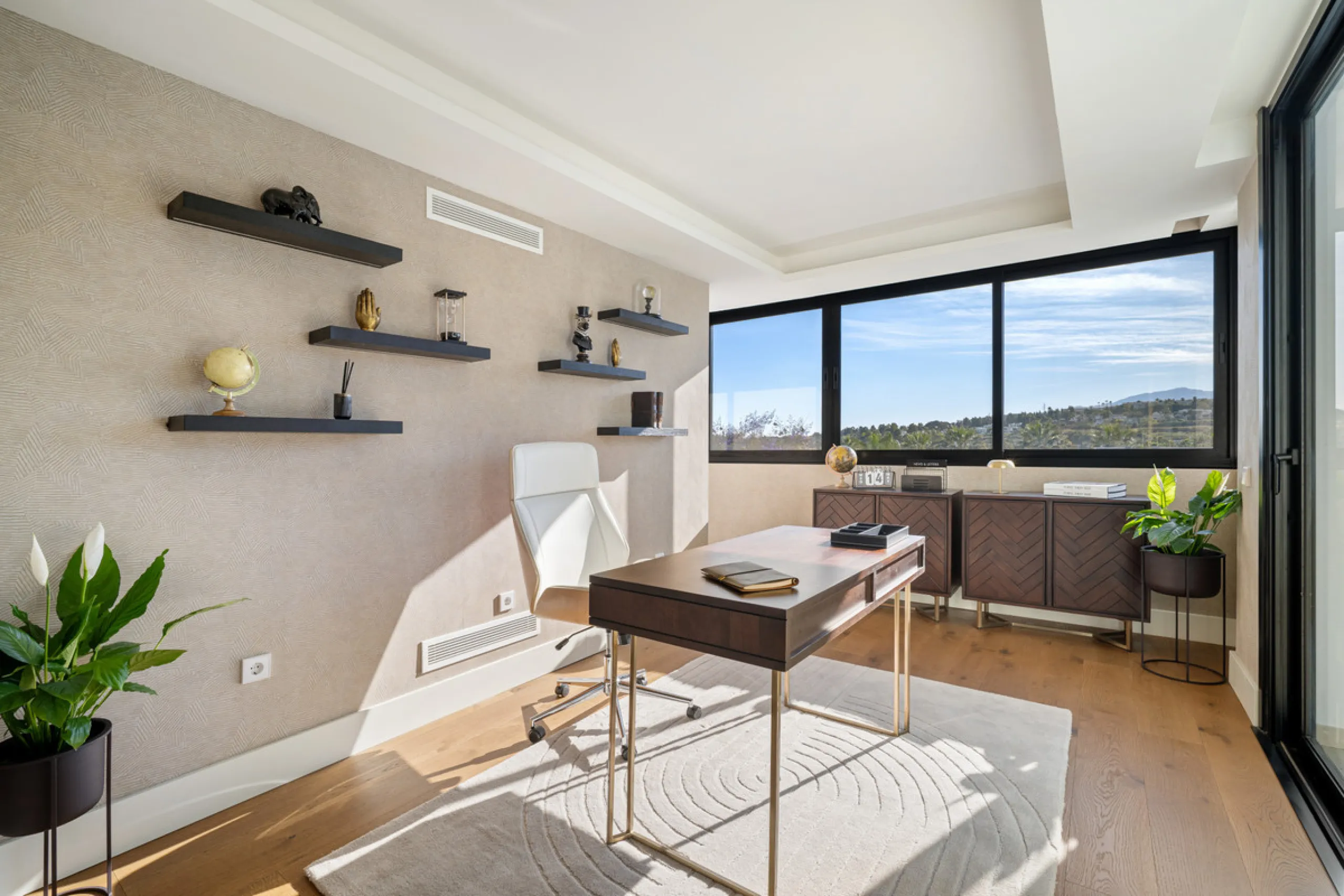 Boasting of unparalleled architecture and unrivalled construction quality, the villa offers sophisticated and contemporary living, sitting on a private plot within a secure community with breathtaking front-line panoramic views towards Los Naranjos Golf c