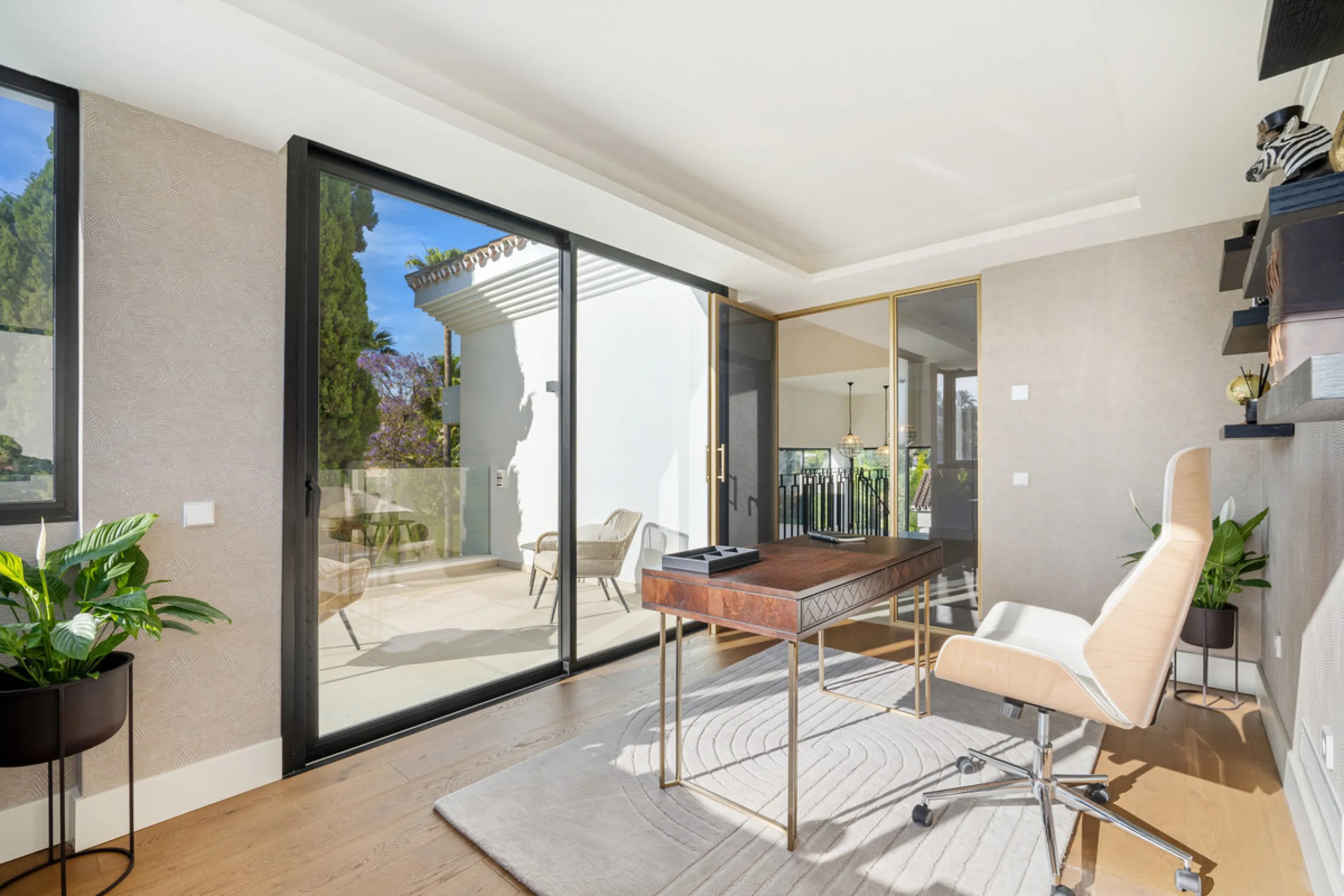 Boasting of unparalleled architecture and unrivalled construction quality, the villa offers sophisticated and contemporary living, sitting on a private plot within a secure community with breathtaking front-line panoramic views towards Los Naranjos Golf c