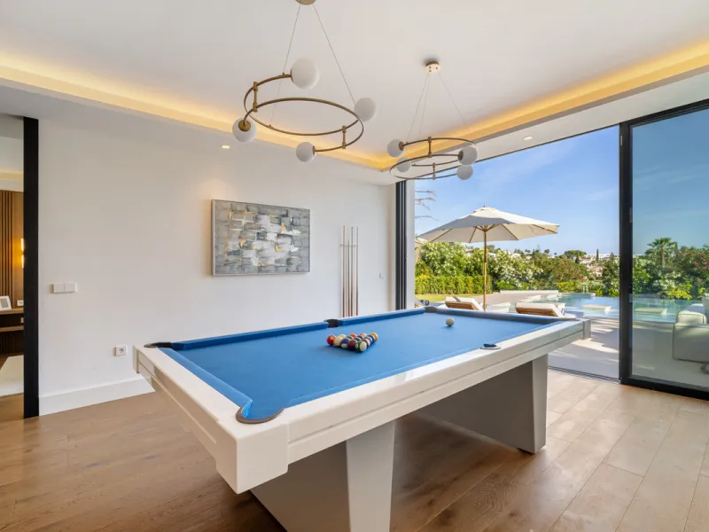 Boasting of unparalleled architecture and unrivalled construction quality, the villa offers sophisticated and contemporary living, sitting on a private plot within a secure community with breathtaking front-line panoramic views towards Los Naranjos Golf c