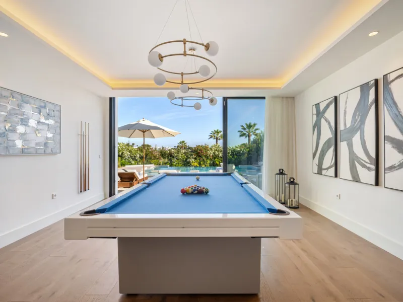 Boasting of unparalleled architecture and unrivalled construction quality, the villa offers sophisticated and contemporary living, sitting on a private plot within a secure community with breathtaking front-line panoramic views towards Los Naranjos Golf c