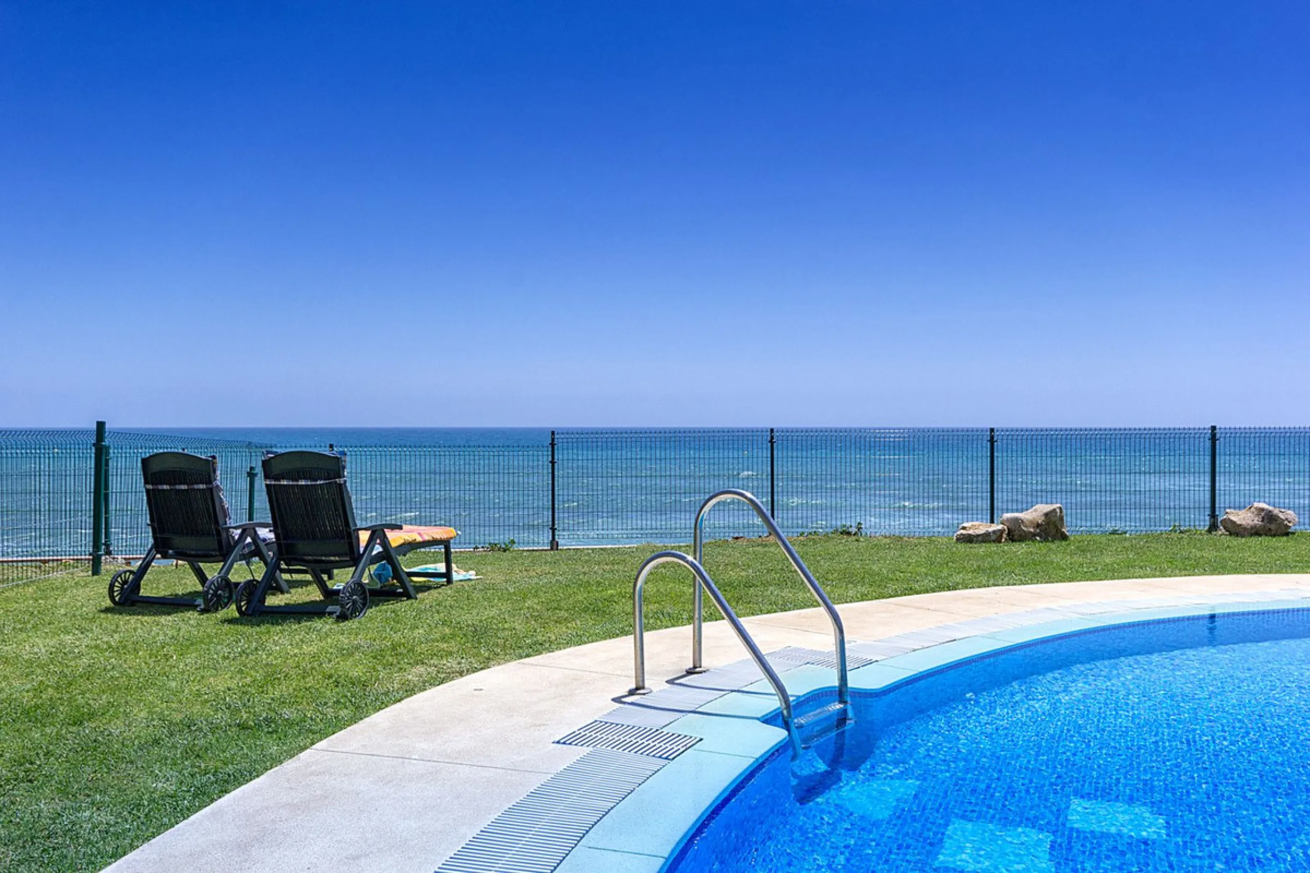 LOCATION! Discover the perfect coastal retreat with this beachfront first-floor apartment located in the prestigious community of Calahonda. This charming flat features two spacious bedrooms and two bathrooms, providing ample space for relaxation and comf