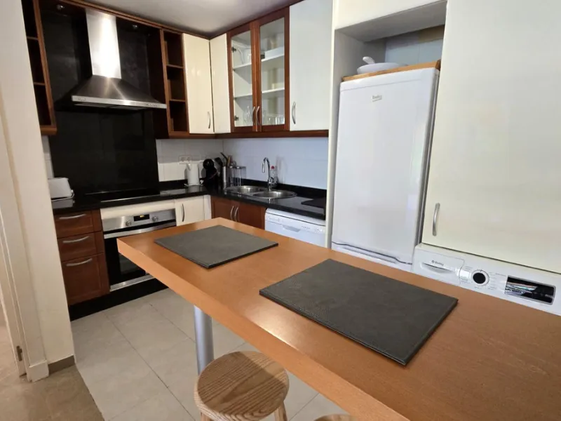 JUST REDUCED .LUXURY GROUND FLOOR GATED COMMUNITY. FRONT LINE GOLF. 2 BED 2 BATH APARTMENT MIRAFLORES. € 299,950 WITH EXISTING TOURIST LICENCE.