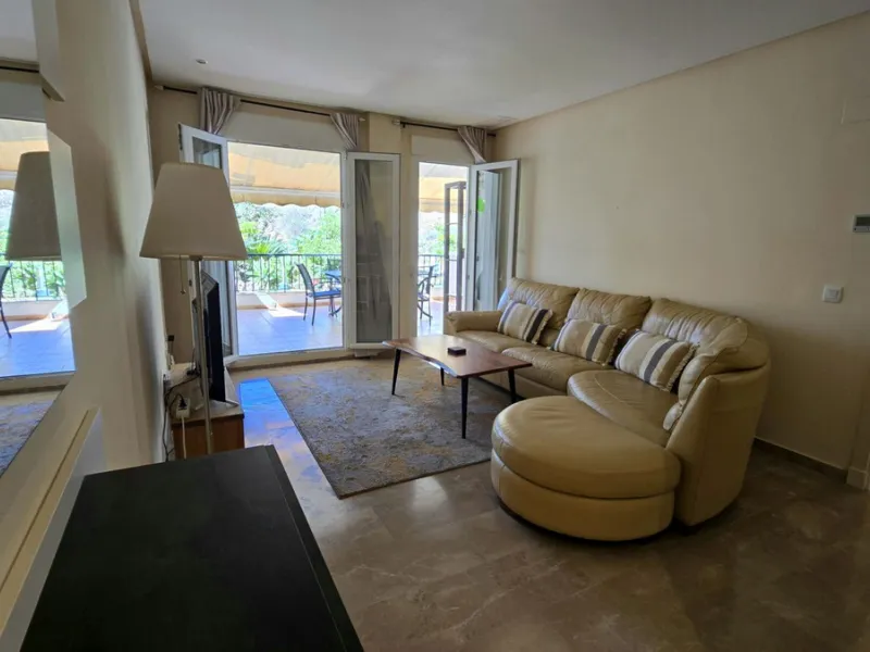 JUST REDUCED .LUXURY GROUND FLOOR GATED COMMUNITY. FRONT LINE GOLF. 2 BED 2 BATH APARTMENT MIRAFLORES. € 299,950 WITH EXISTING TOURIST LICENCE.