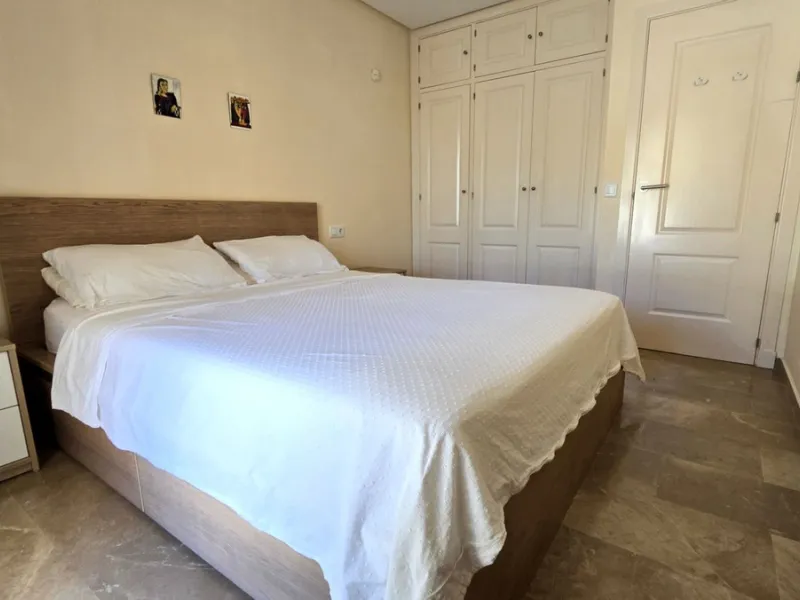 JUST REDUCED .LUXURY GROUND FLOOR GATED COMMUNITY. FRONT LINE GOLF. 2 BED 2 BATH APARTMENT MIRAFLORES. € 299,950 WITH EXISTING TOURIST LICENCE.