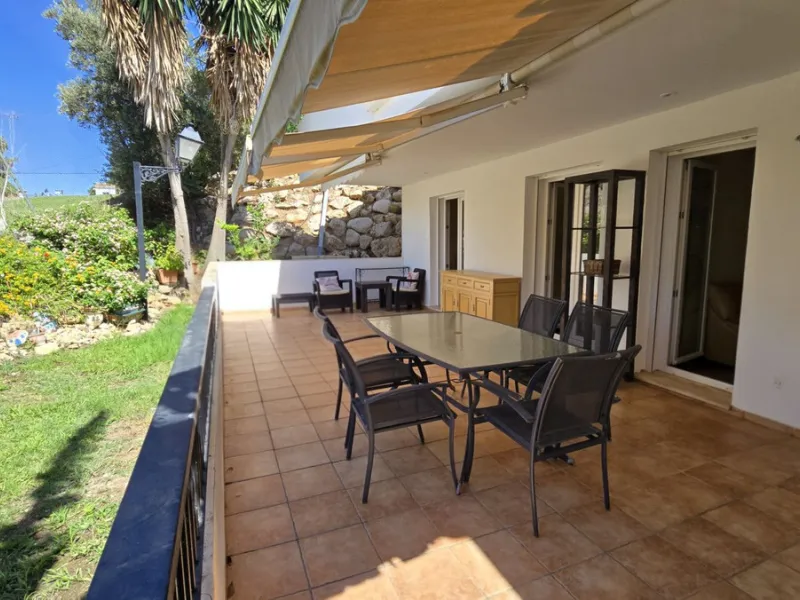 JUST REDUCED .LUXURY GROUND FLOOR GATED COMMUNITY. FRONT LINE GOLF. 2 BED 2 BATH APARTMENT MIRAFLORES. € 299,950 WITH EXISTING TOURIST LICENCE.