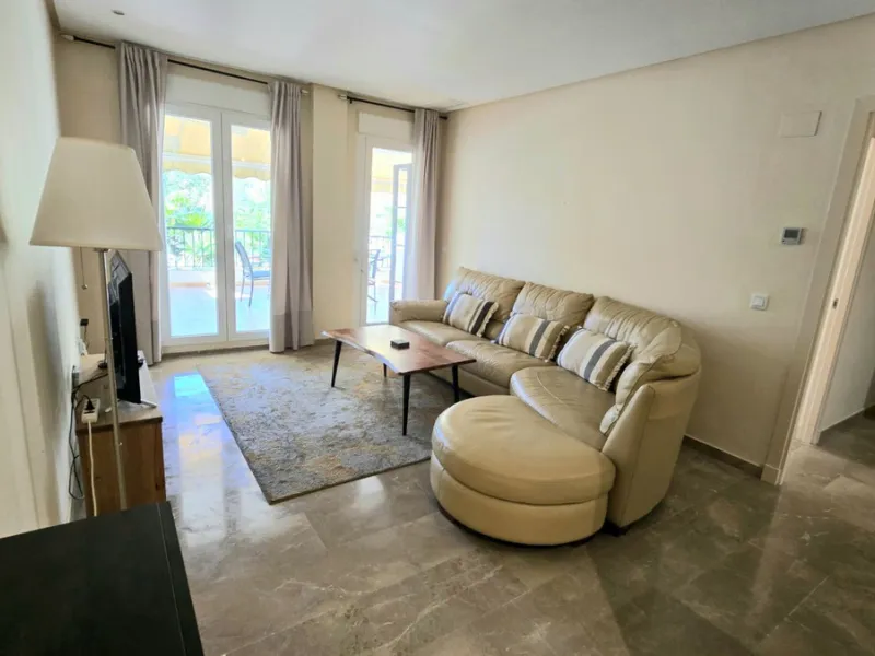 JUST REDUCED .LUXURY GROUND FLOOR GATED COMMUNITY. FRONT LINE GOLF. 2 BED 2 BATH APARTMENT MIRAFLORES. € 299,950 WITH EXISTING TOURIST LICENCE.
