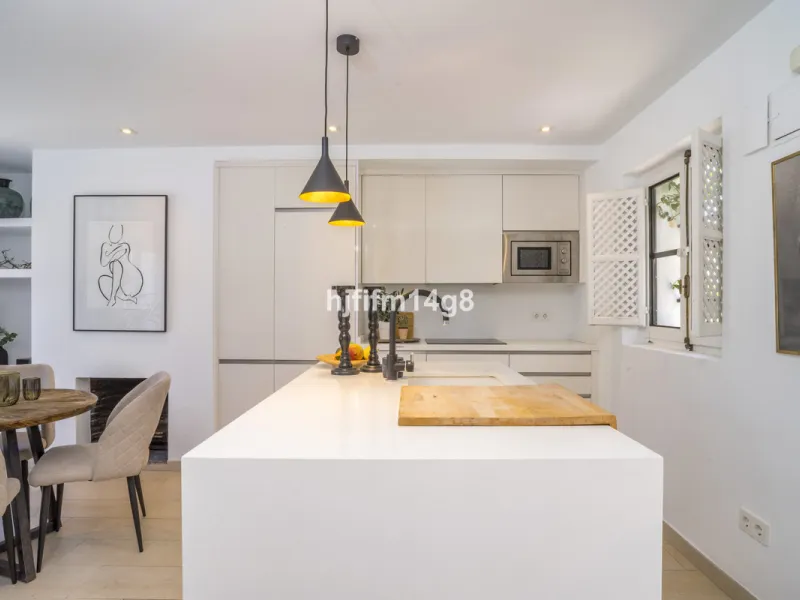Nestled in the heart of the sought-after El Naranjal urbanisation, this delightful townhouse blends traditional Andalusian character with modern comfort. Located within a secure gated community renowned for its cobbled streets, picturesque patios, and vib