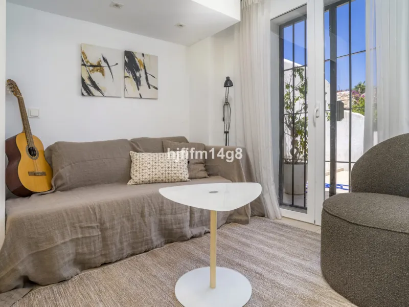Nestled in the heart of the sought-after El Naranjal urbanisation, this delightful townhouse blends traditional Andalusian character with modern comfort. Located within a secure gated community renowned for its cobbled streets, picturesque patios, and vib