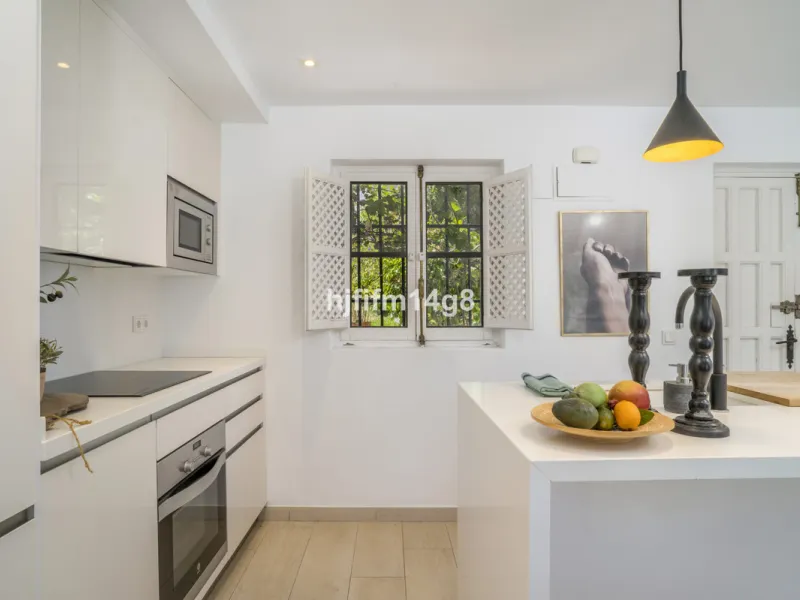 Nestled in the heart of the sought-after El Naranjal urbanisation, this delightful townhouse blends traditional Andalusian character with modern comfort. Located within a secure gated community renowned for its cobbled streets, picturesque patios, and vib