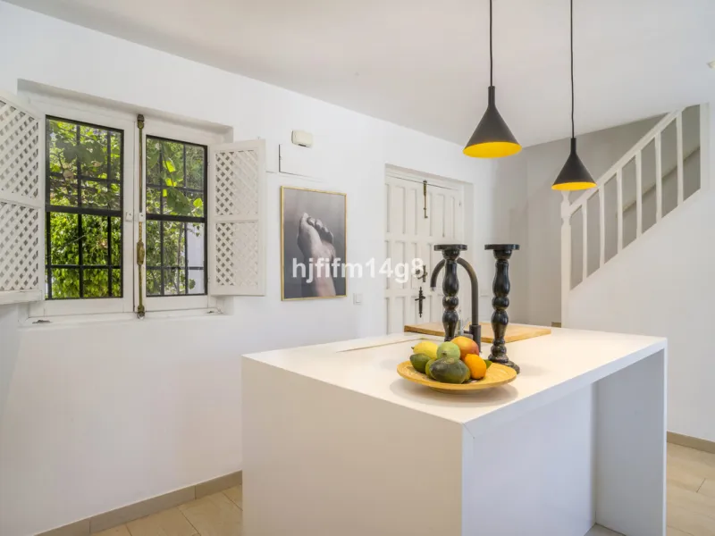 Nestled in the heart of the sought-after El Naranjal urbanisation, this delightful townhouse blends traditional Andalusian character with modern comfort. Located within a secure gated community renowned for its cobbled streets, picturesque patios, and vib