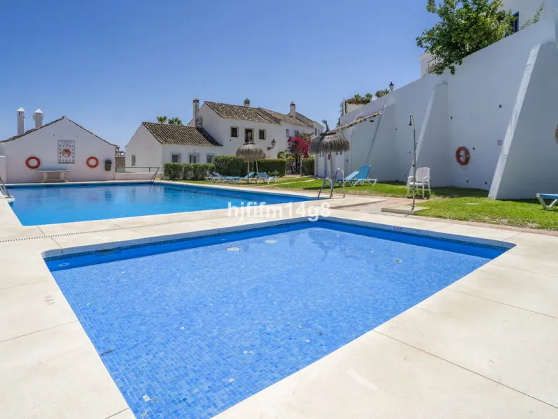 Nestled in the heart of the sought-after El Naranjal urbanisation, this delightful townhouse blends traditional Andalusian character with modern comfort. Located within a secure gated community renowned for its cobbled streets, picturesque patios, and vib