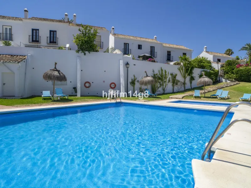Nestled in the heart of the sought-after El Naranjal urbanisation, this delightful townhouse blends traditional Andalusian character with modern comfort. Located within a secure gated community renowned for its cobbled streets, picturesque patios, and vib