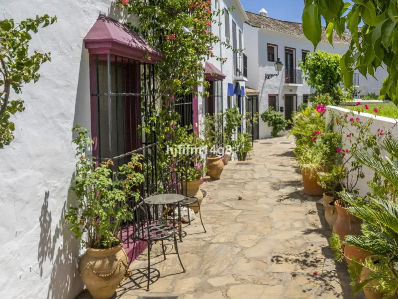 Nestled in the heart of the sought-after El Naranjal urbanisation, this delightful townhouse blends traditional Andalusian character with modern comfort. Located within a secure gated community renowned for its cobbled streets, picturesque patios, and vib