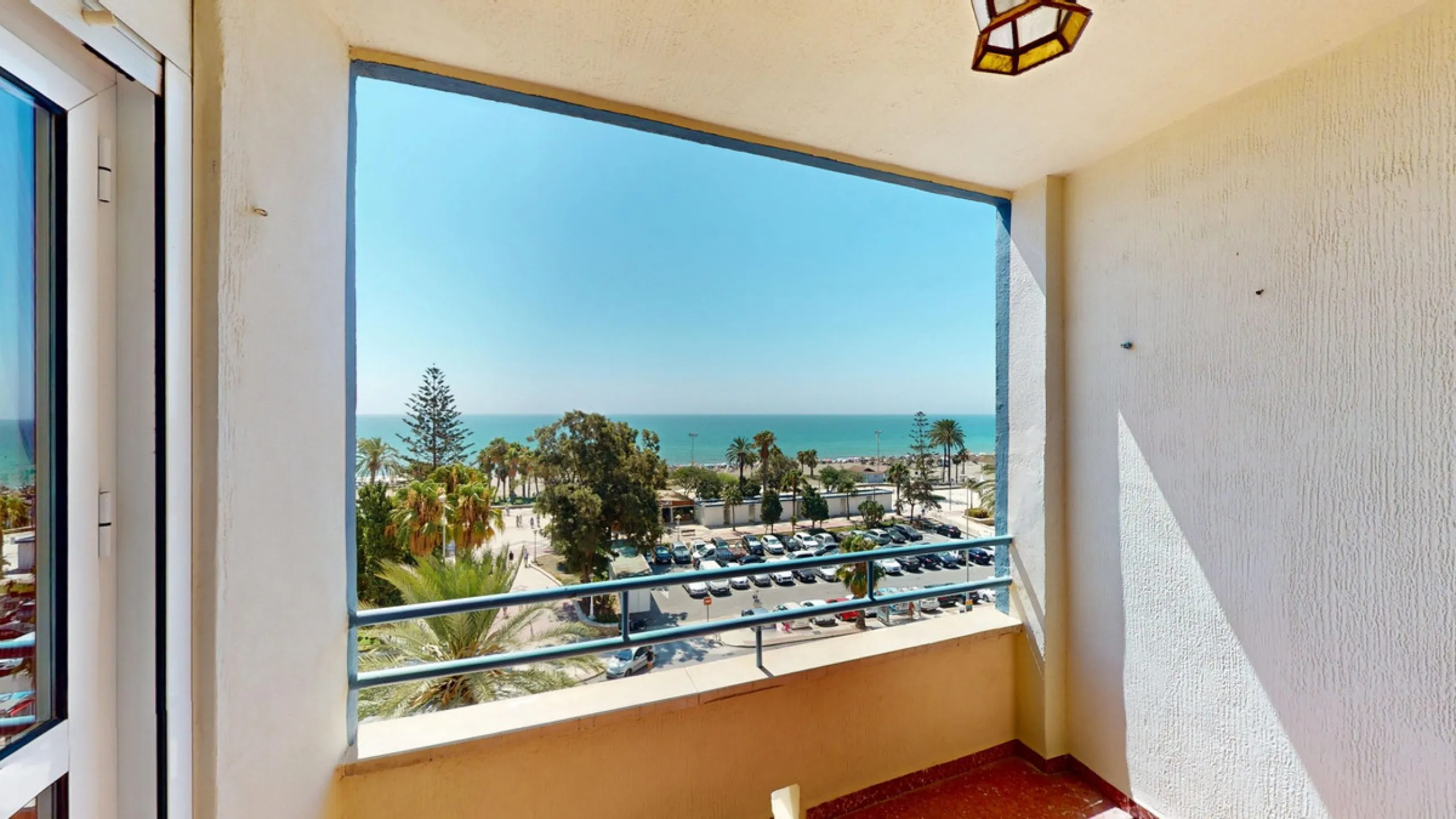 Discover this exceptional 3-bedroom apartment located on one of Torre del Mars main streets, just steps from the beach. This frontline property offers stunning panoramic sea views from all three bedrooms, with two featuring built-in wardrobes for added co