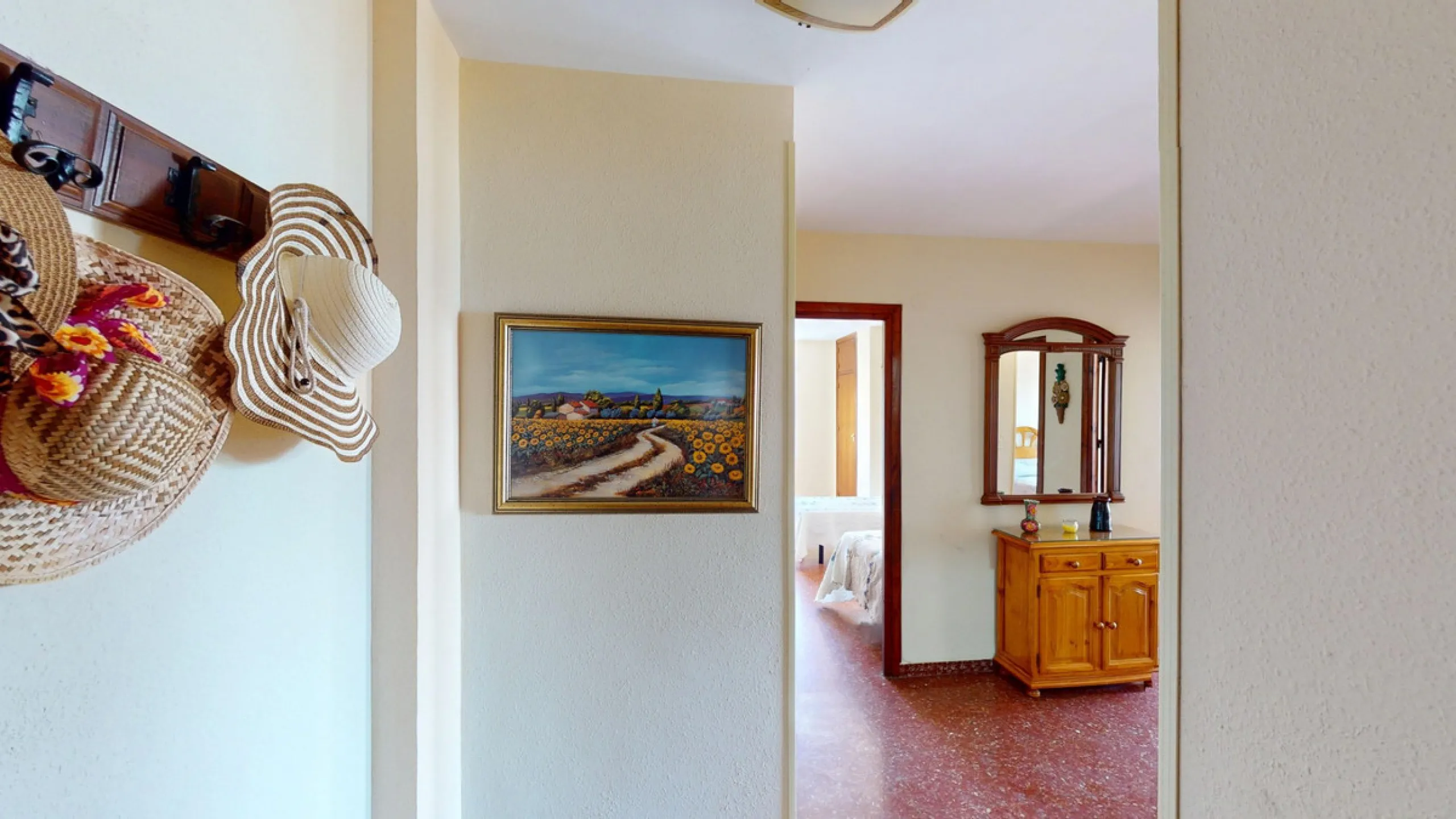 Discover this exceptional 3-bedroom apartment located on one of Torre del Mars main streets, just steps from the beach. This frontline property offers stunning panoramic sea views from all three bedrooms, with two featuring built-in wardrobes for added co