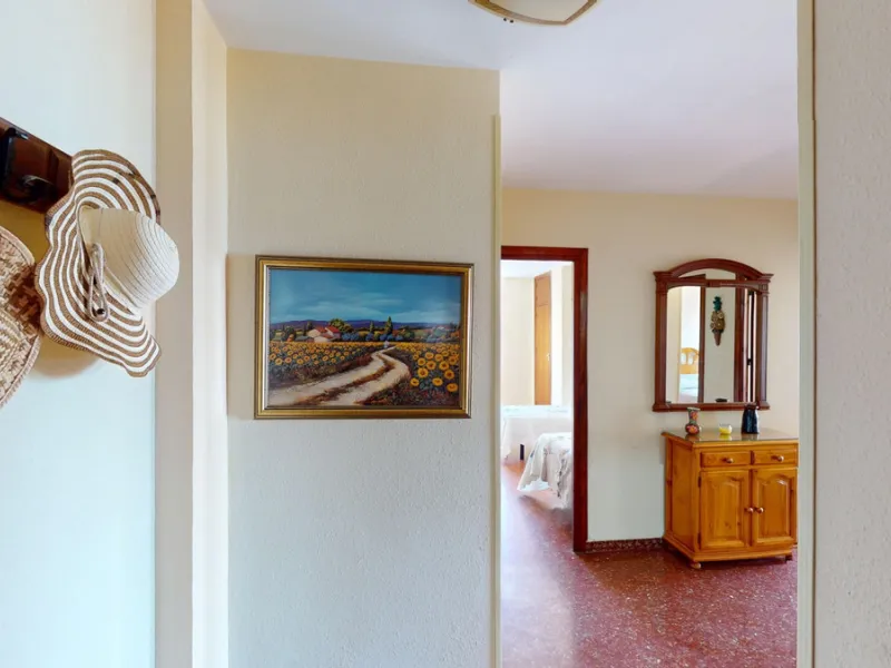 Discover this exceptional 3-bedroom apartment located on one of Torre del Mars main streets, just steps from the beach. This frontline property offers stunning panoramic sea views from all three bedrooms, with two featuring built-in wardrobes for added co