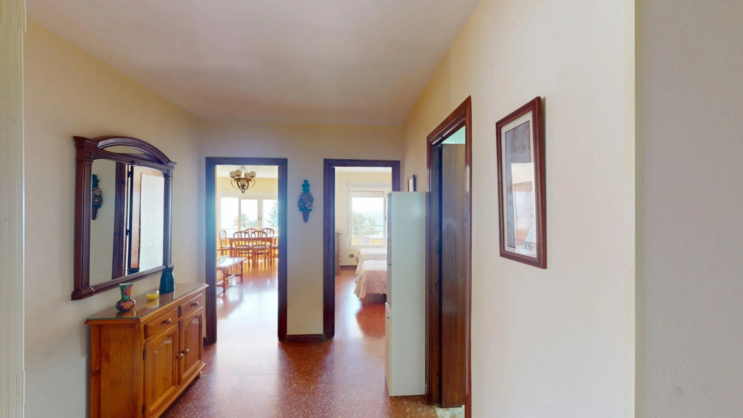 Discover this exceptional 3-bedroom apartment located on one of Torre del Mars main streets, just steps from the beach. This frontline property offers stunning panoramic sea views from all three bedrooms, with two featuring built-in wardrobes for added co