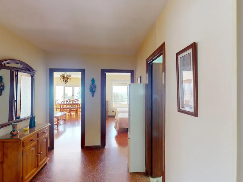 Discover this exceptional 3-bedroom apartment located on one of Torre del Mars main streets, just steps from the beach. This frontline property offers stunning panoramic sea views from all three bedrooms, with two featuring built-in wardrobes for added co