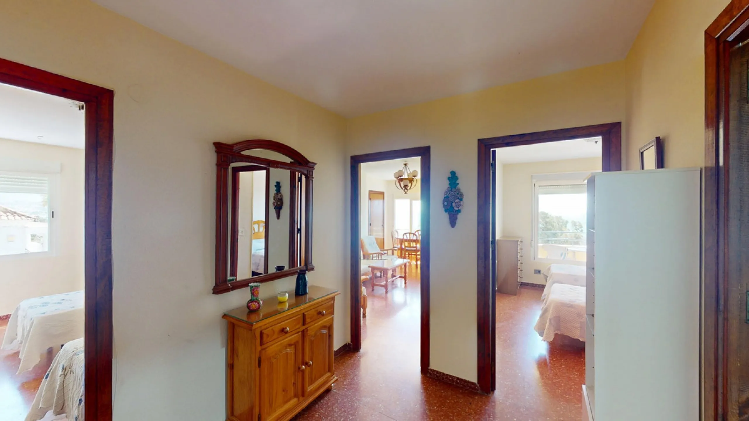 Discover this exceptional 3-bedroom apartment located on one of Torre del Mars main streets, just steps from the beach. This frontline property offers stunning panoramic sea views from all three bedrooms, with two featuring built-in wardrobes for added co