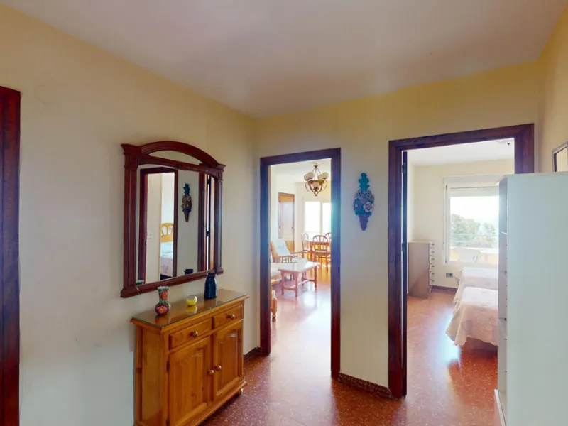 Discover this exceptional 3-bedroom apartment located on one of Torre del Mars main streets, just steps from the beach. This frontline property offers stunning panoramic sea views from all three bedrooms, with two featuring built-in wardrobes for added co