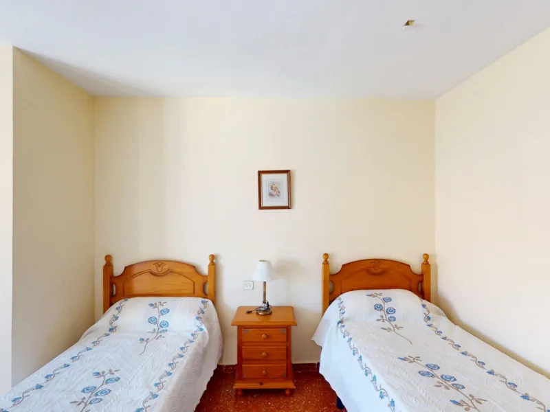 Discover this exceptional 3-bedroom apartment located on one of Torre del Mars main streets, just steps from the beach. This frontline property offers stunning panoramic sea views from all three bedrooms, with two featuring built-in wardrobes for added co