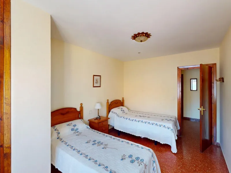 Discover this exceptional 3-bedroom apartment located on one of Torre del Mars main streets, just steps from the beach. This frontline property offers stunning panoramic sea views from all three bedrooms, with two featuring built-in wardrobes for added co