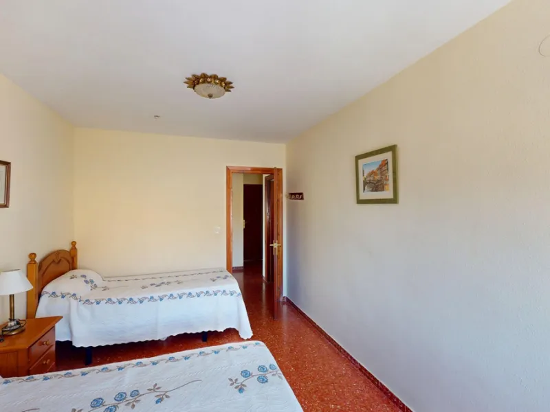 Discover this exceptional 3-bedroom apartment located on one of Torre del Mars main streets, just steps from the beach. This frontline property offers stunning panoramic sea views from all three bedrooms, with two featuring built-in wardrobes for added co