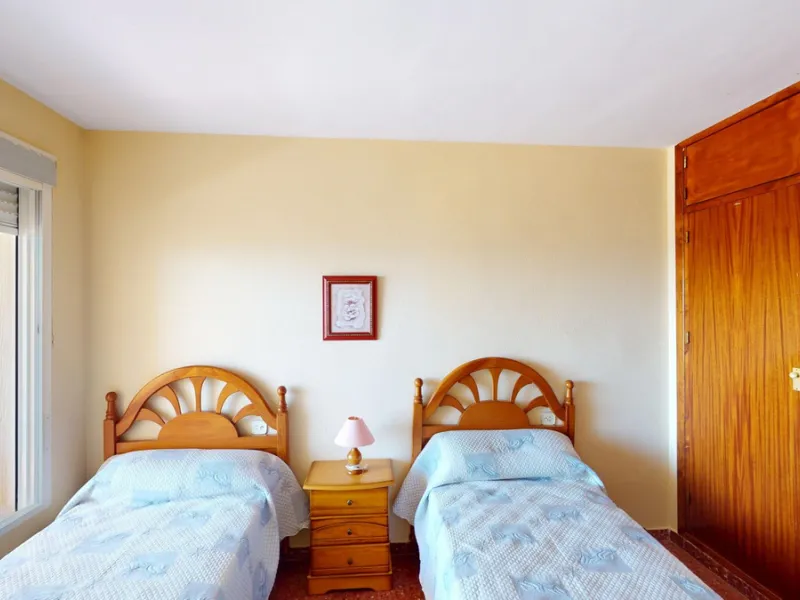 Discover this exceptional 3-bedroom apartment located on one of Torre del Mars main streets, just steps from the beach. This frontline property offers stunning panoramic sea views from all three bedrooms, with two featuring built-in wardrobes for added co