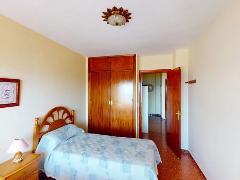 Discover this exceptional 3-bedroom apartment located on one of Torre del Mars main streets, just steps from the beach. This frontline property offers stunning panoramic sea views from all three bedrooms, with two featuring built-in wardrobes for added co