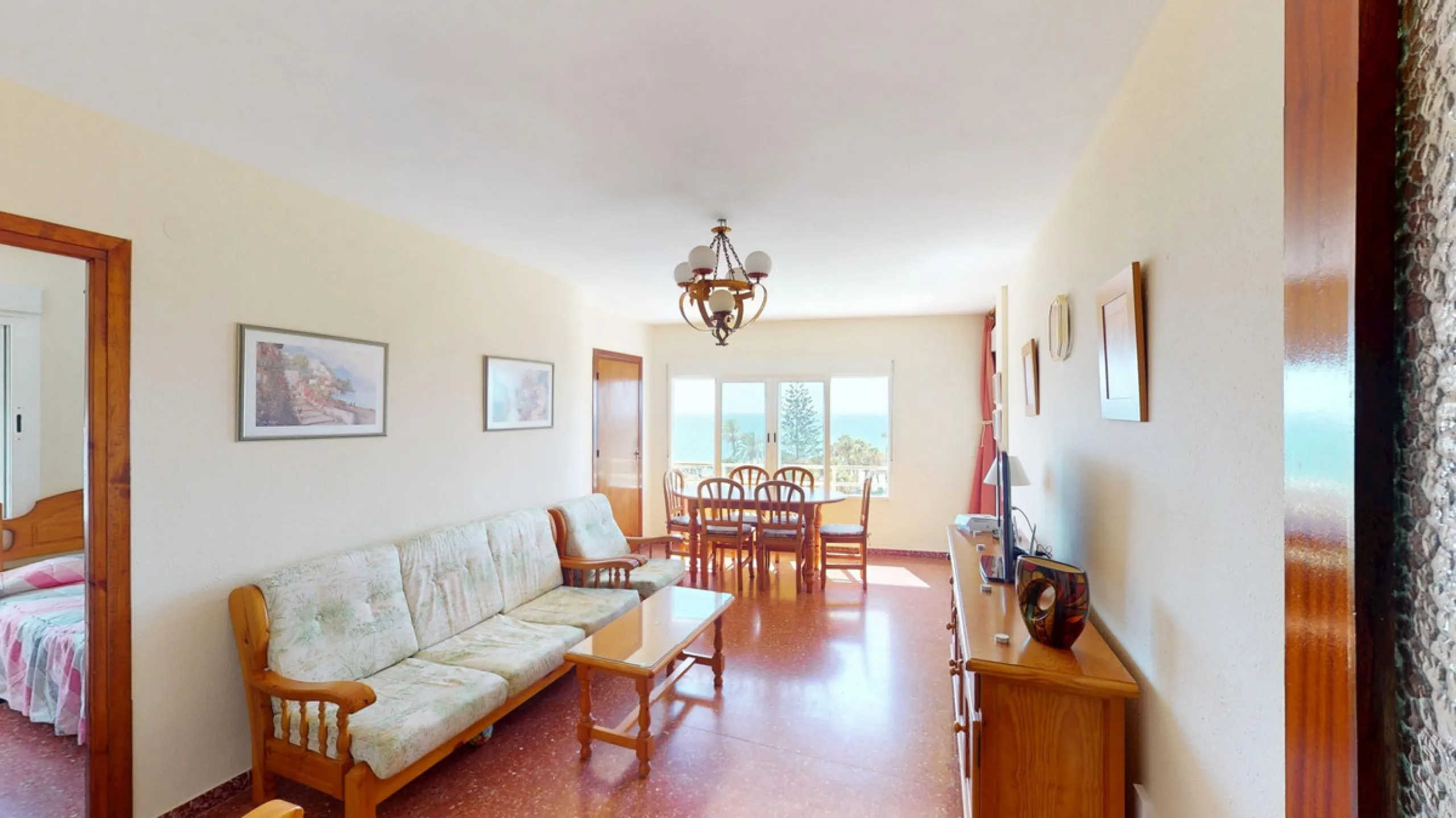 Discover this exceptional 3-bedroom apartment located on one of Torre del Mars main streets, just steps from the beach. This frontline property offers stunning panoramic sea views from all three bedrooms, with two featuring built-in wardrobes for added co